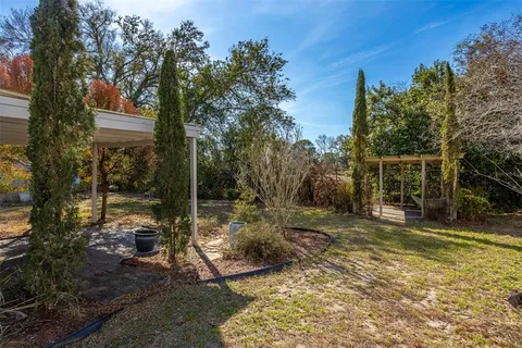 a backyard of a house with lots of green space
