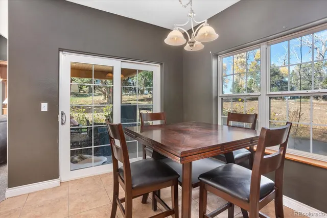 a view of a hallway with a livingroom and furniture