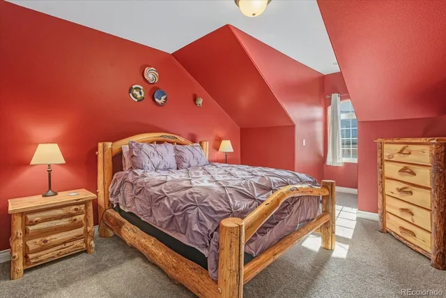 a view of a house with a yard and mountain view