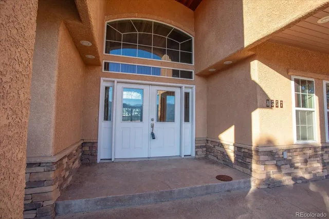a view of a backyard with table and chairs