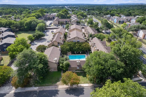an aerial view of a house with a garden