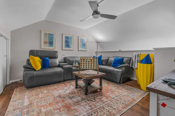 a living room with furniture and a rug