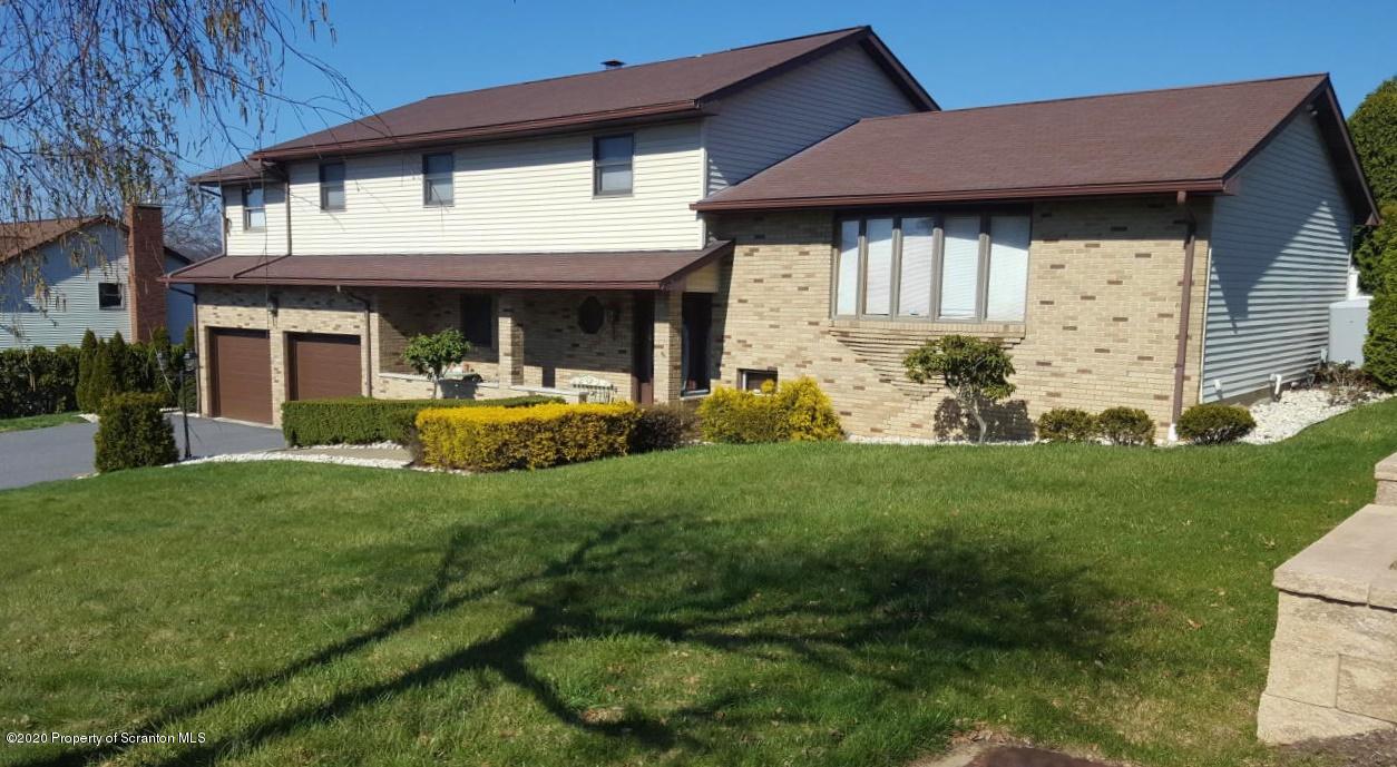 3 Patrick Road Pittston, PA 18640 - Photo 1 of 16 a front view of a house with garden