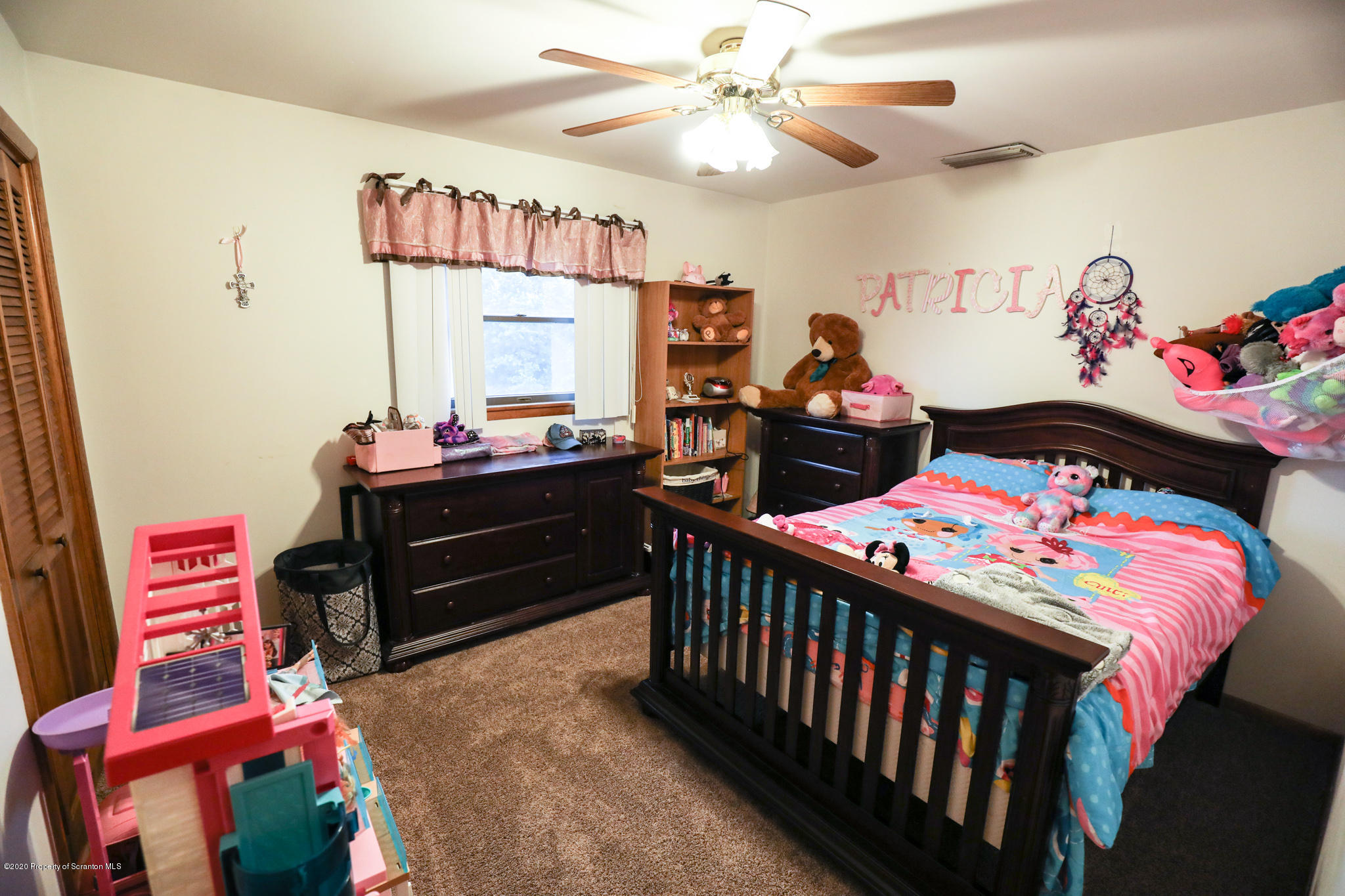 3 Patrick Road Pittston, PA 18640 - Photo 11 of 16 a bedroom with a bed and a chandelier