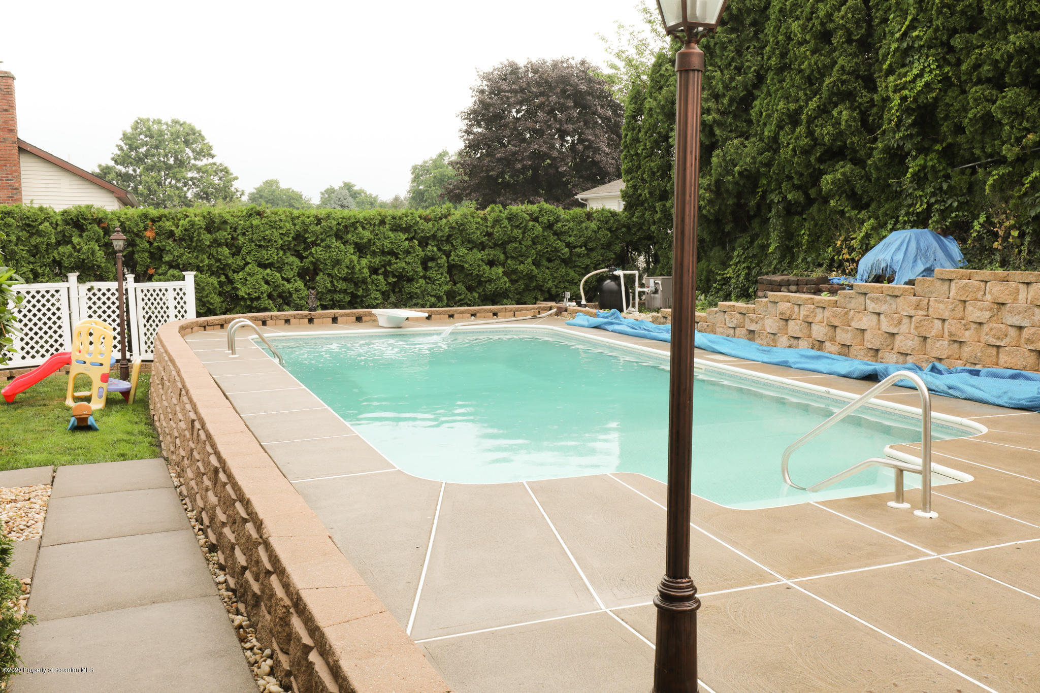 3 Patrick Road Pittston, PA 18640 - Photo 16 of 16 a view of a swimming pool with a patio