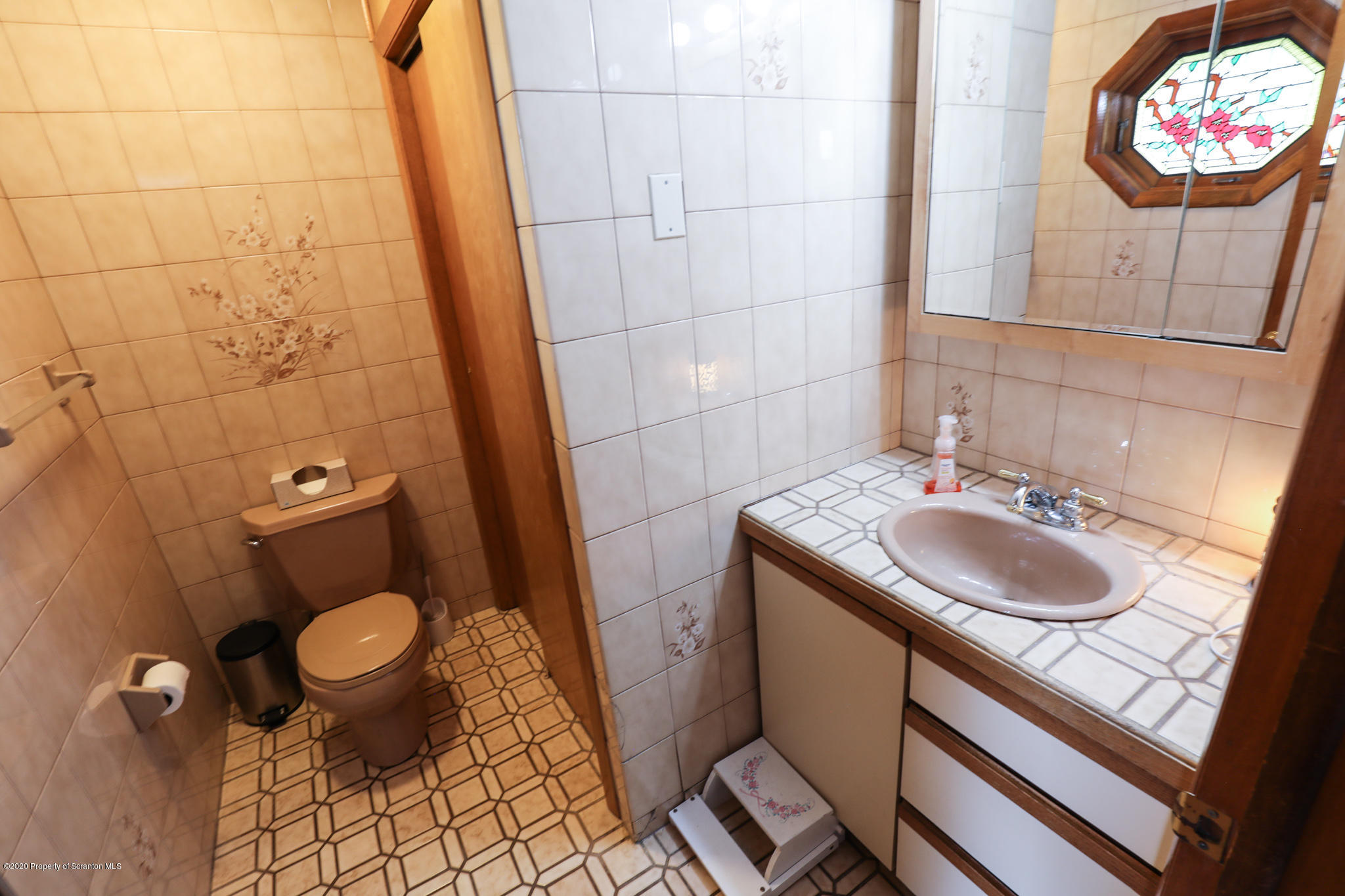 3 Patrick Road Pittston, PA 18640 - Photo 5 of 16 a bathroom with a sink and a mirror