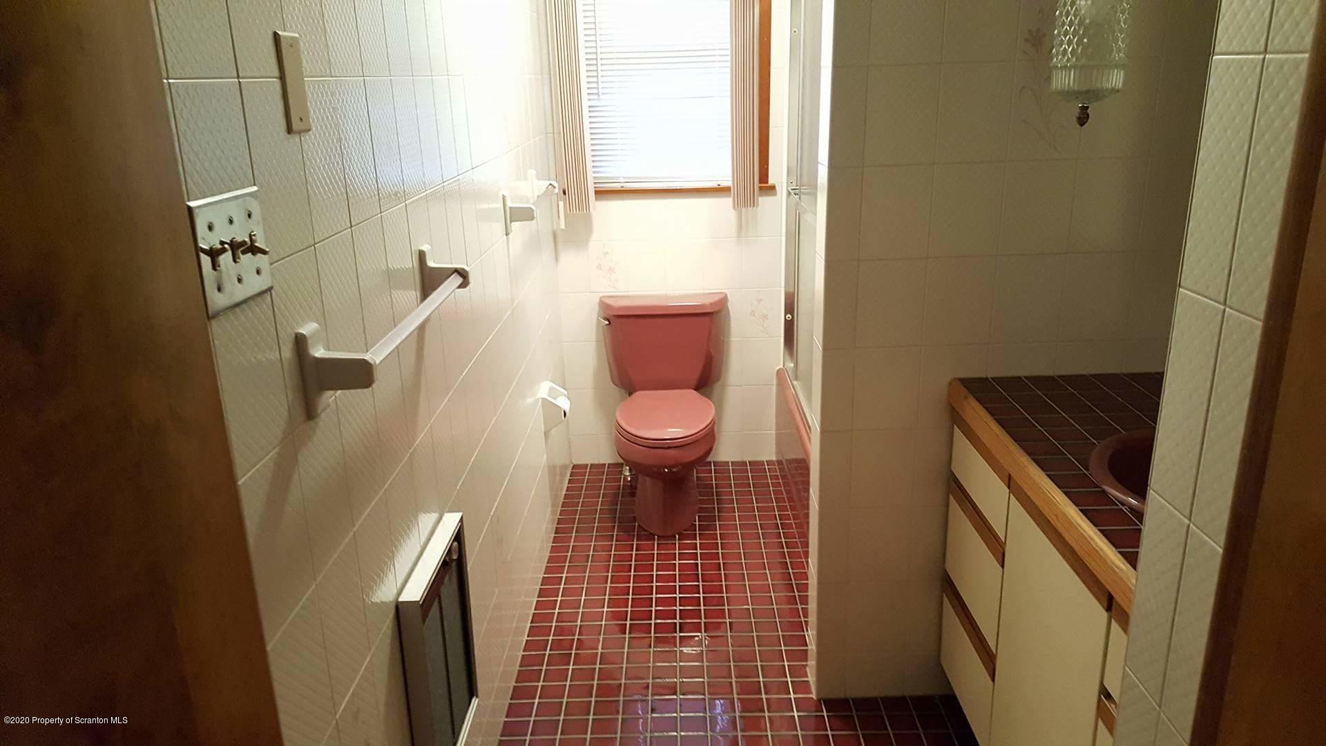 3 Patrick Road Pittston, PA 18640 - Photo 7 of 16 a bathroom with a sink and a toilet