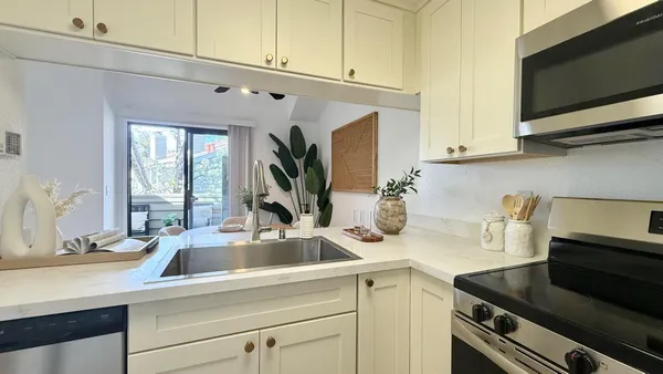 a kitchen with a sink and a microwave