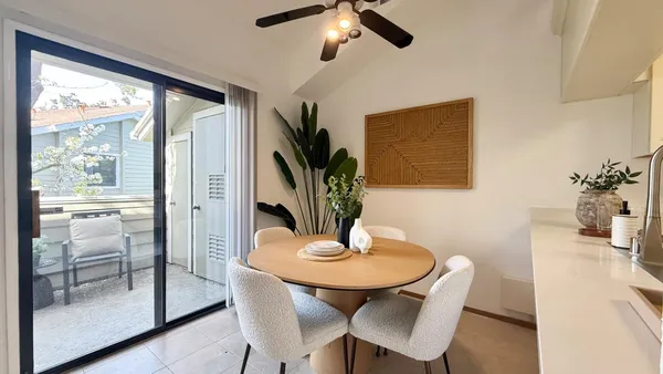 a view of a dining room with furniture window and outside view