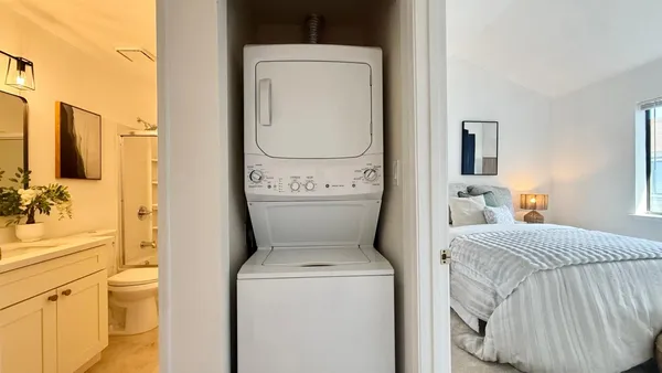 a en suite bathroom with a toilet and a tub