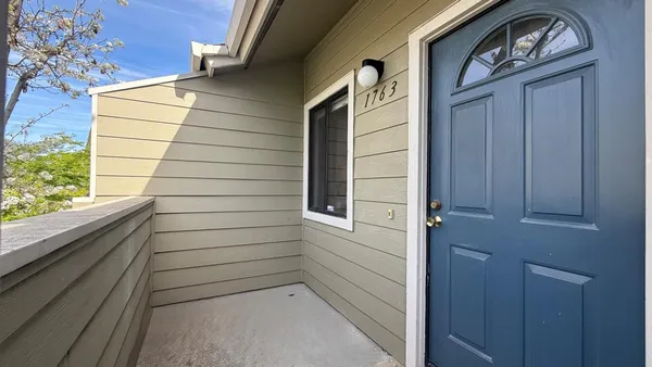 a view of a door and a window