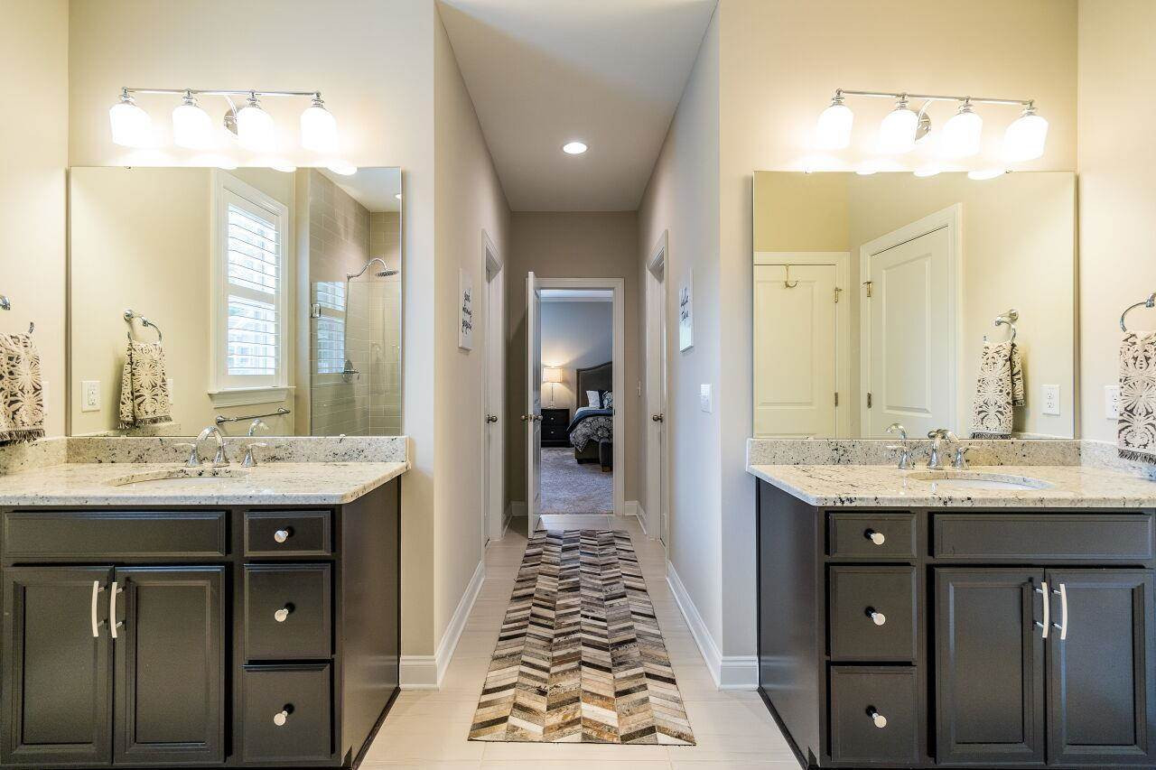 5268 Aleppo Lane Raleigh, NC 27613 - Photo 20 of 30 Spa bath features dual vanities, soaking tub, glass enclosed shower and separate water closet. Owner's Suite