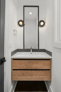 a bathroom with a sink and a mirror