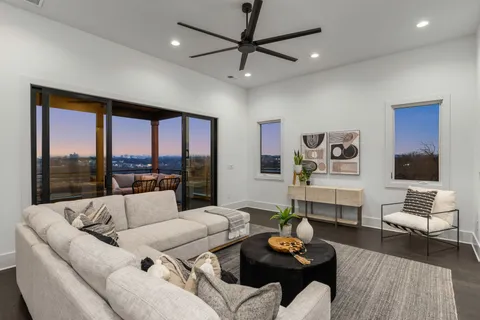 a living room with furniture and a large window