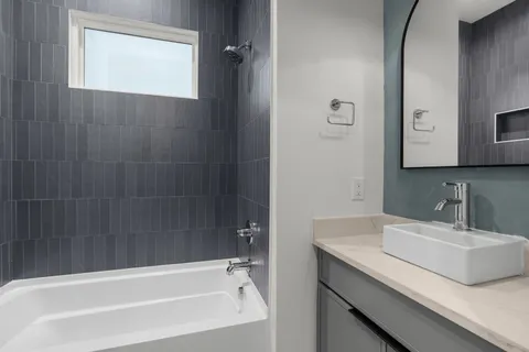 a bathroom with a sink and a bathtub