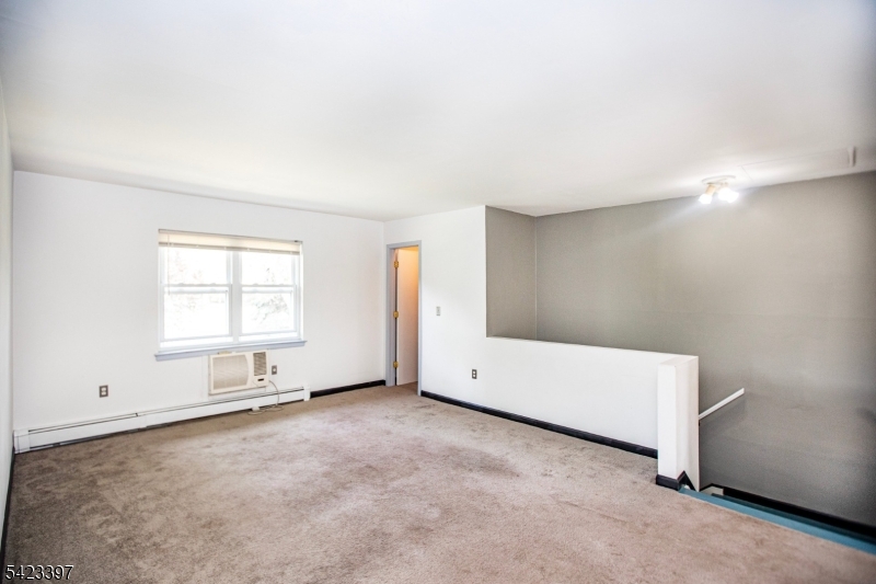 1130 Valley Road, Unit 2B Wayne, NJ 07470 - Photo 10 of 47 an empty room with windows