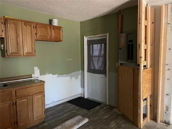 a white bath tub sitting next to a toilet