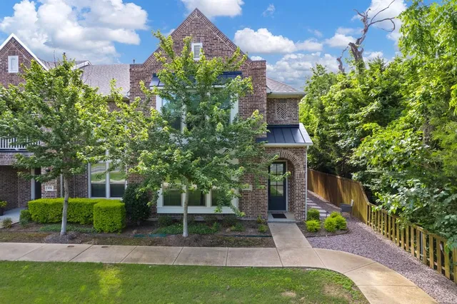 a view of a house with a yard and plants