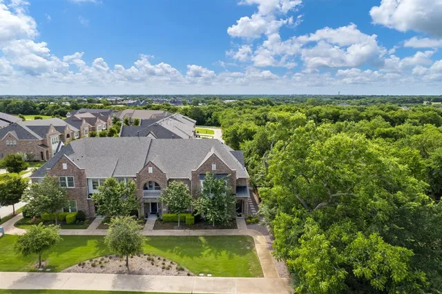 a view of a house with a yard and a garden