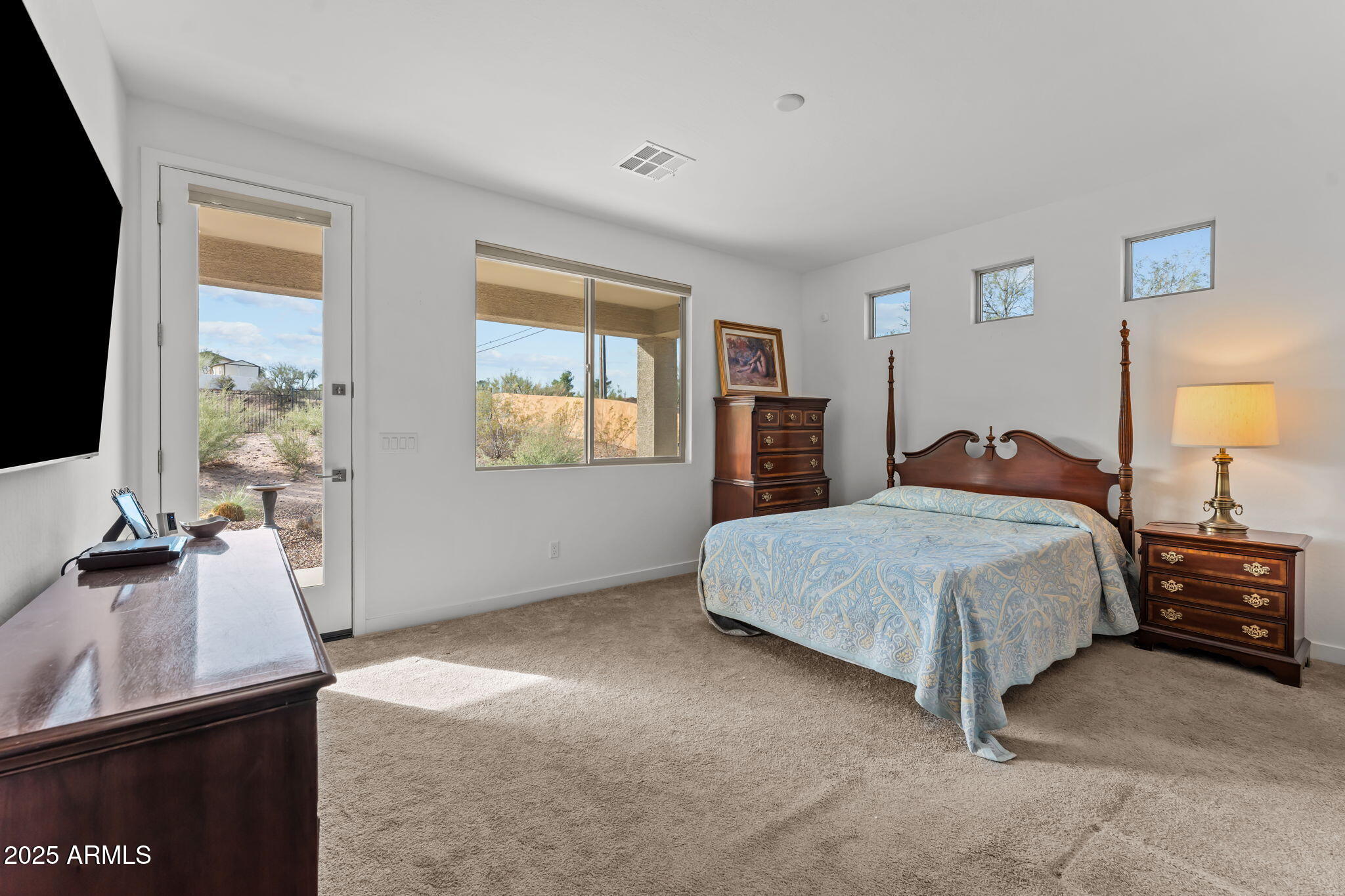 1995 West Ringo Road Wickenburg, AZ 85390 - Photo 11 of 22 a bedroom with a bed and a flat screen tv