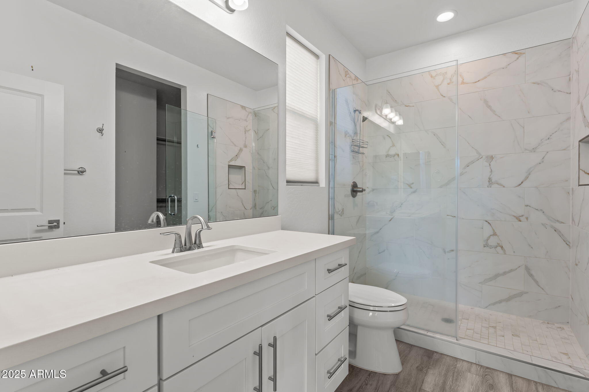 1995 West Ringo Road Wickenburg, AZ 85390 - Photo 12 of 22 a bathroom with a sink a toilet and shower
