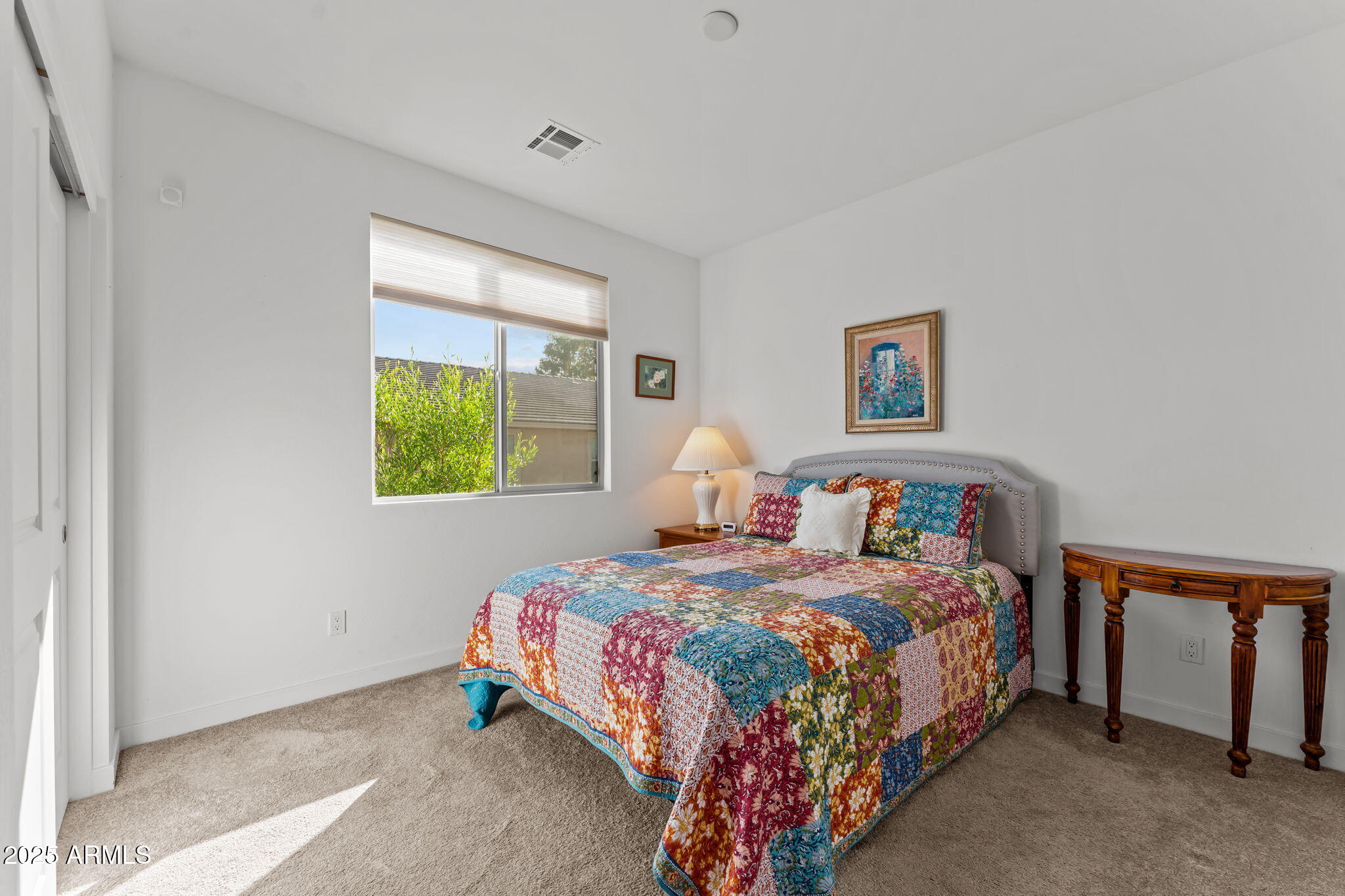1995 West Ringo Road Wickenburg, AZ 85390 - Photo 14 of 22 a bedroom with a bed and a window