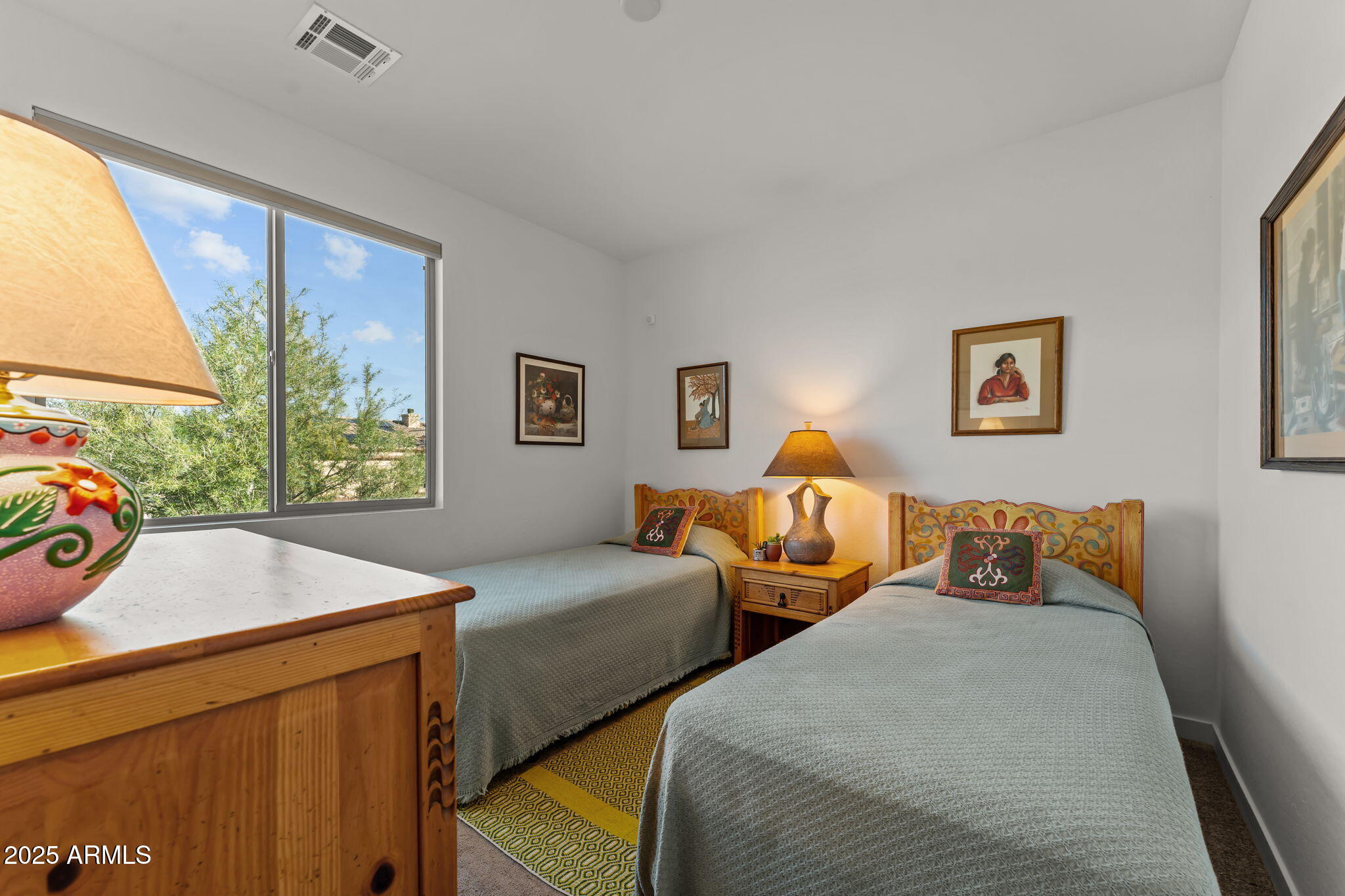 1995 West Ringo Road Wickenburg, AZ 85390 - Photo 16 of 22 a bedroom with two beds and a large window