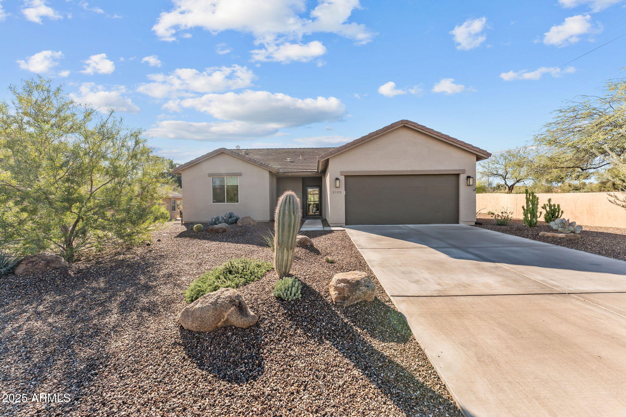 1995 West Ringo Road Wickenburg, AZ 85390 - Photo 22 of 22 a front view of a house with a yard