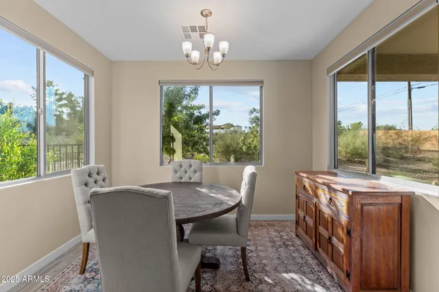 a view of a dining room with furniture window and outside view