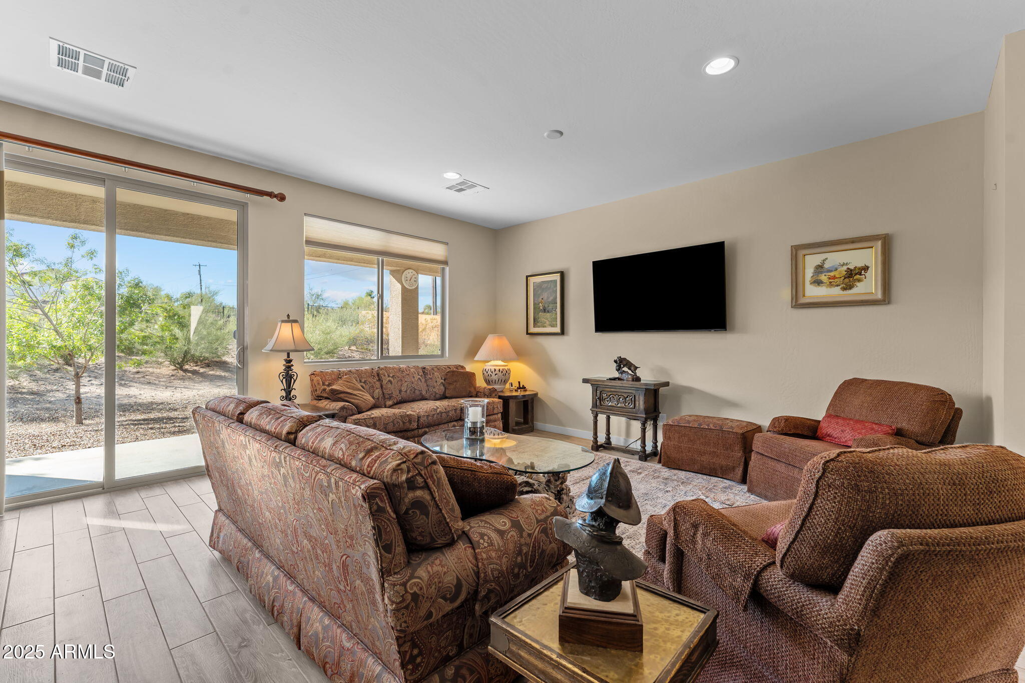1995 West Ringo Road Wickenburg, AZ 85390 - Photo 5 of 22 a living room with furniture and a flat screen tv