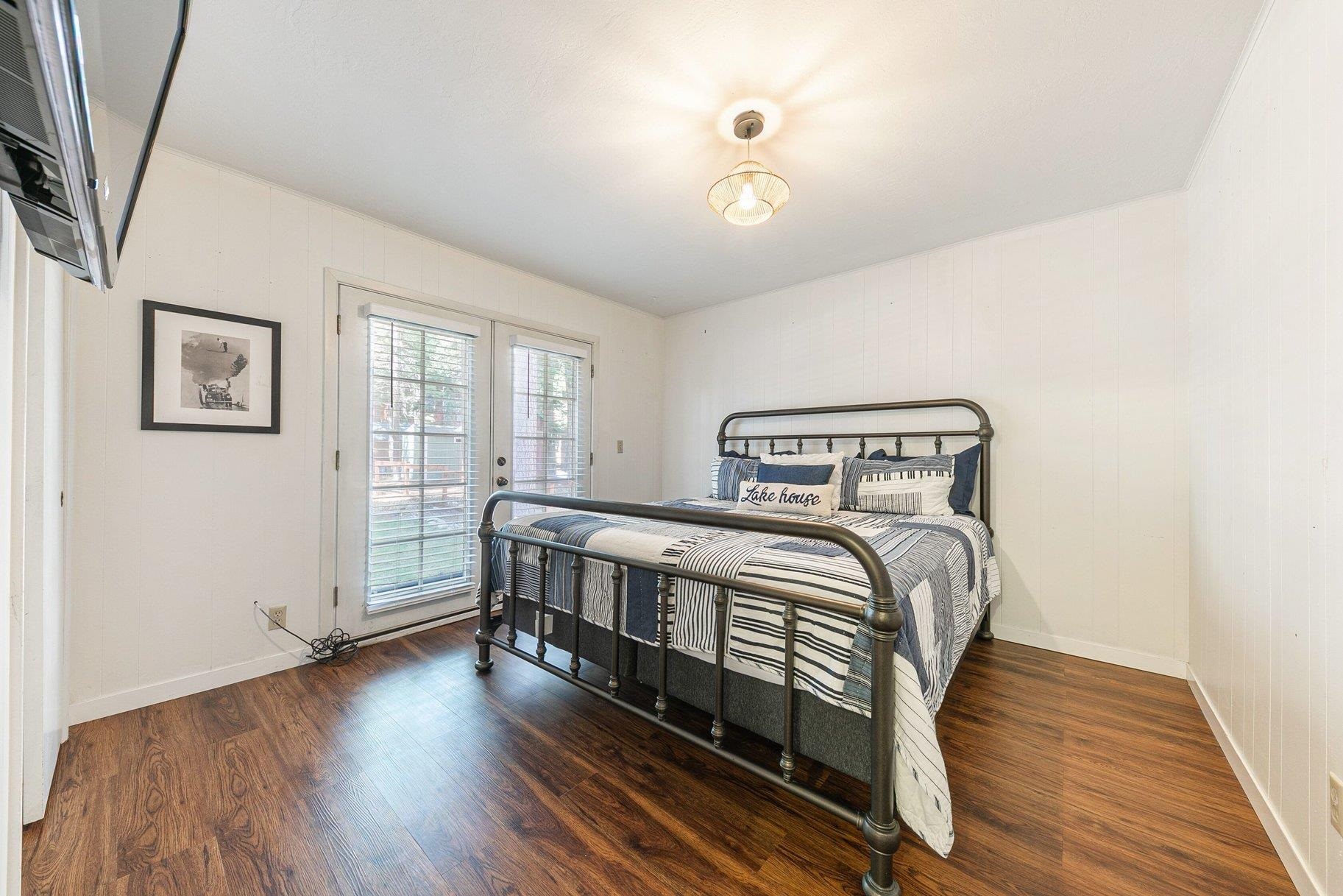 7294 3rd Avenue Tahoma, CA 96142 - Photo 12 of 23 a bedroom with a bed and wooden floor
