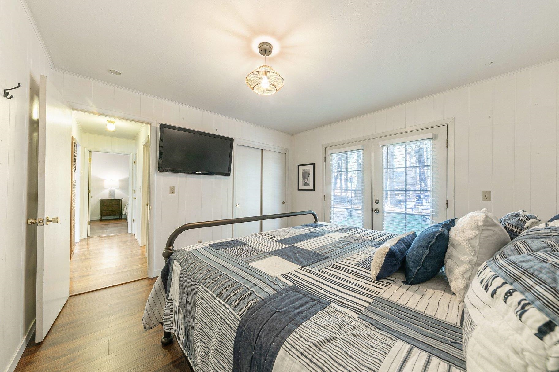 7294 3rd Avenue Tahoma, CA 96142 - Photo 13 of 23 a bedroom with a bed and a flat screen tv