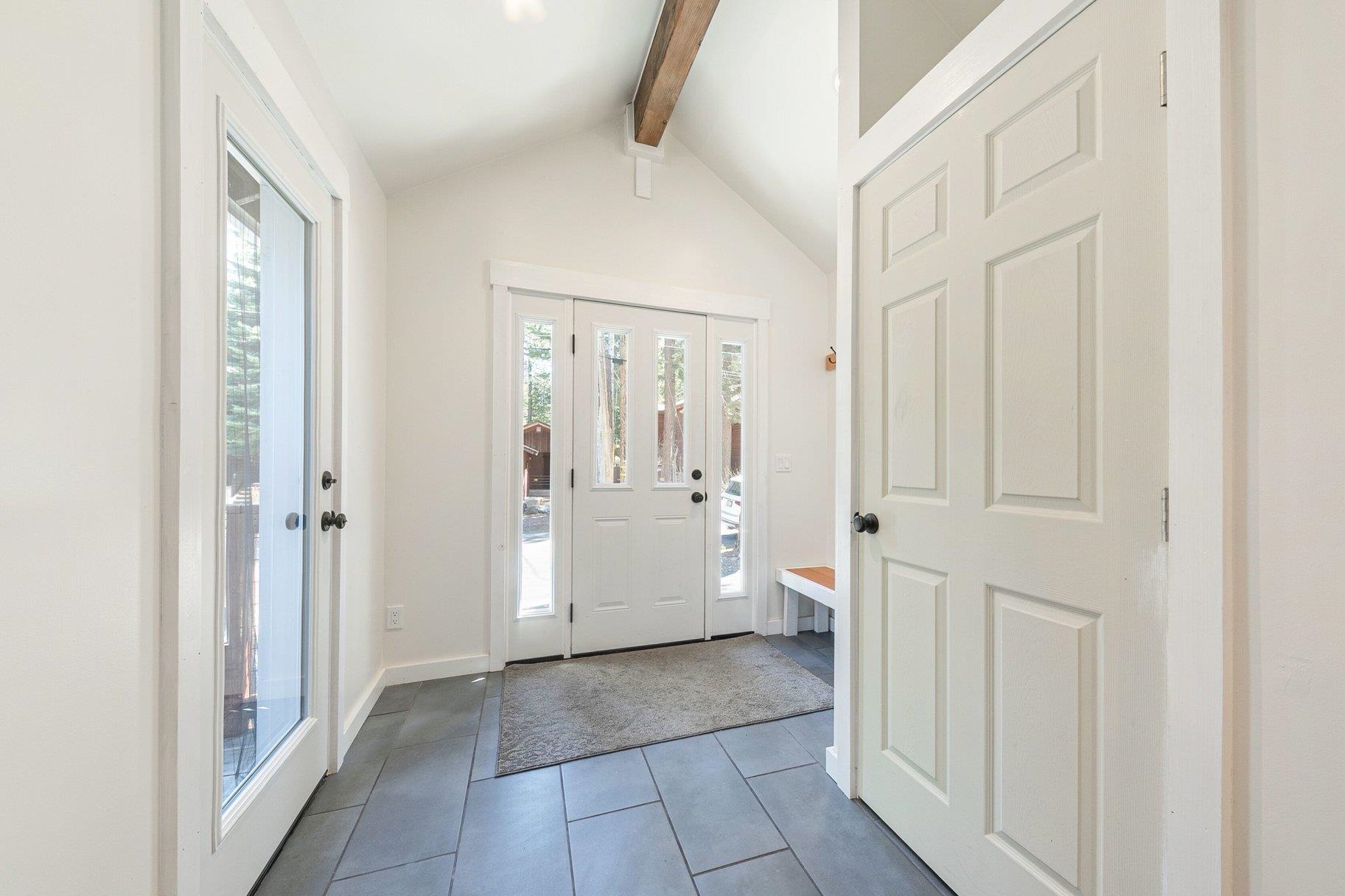 7294 3rd Avenue Tahoma, CA 96142 - Photo 7 of 23 a view of a hallway with a livingroom and a bathroom with sink