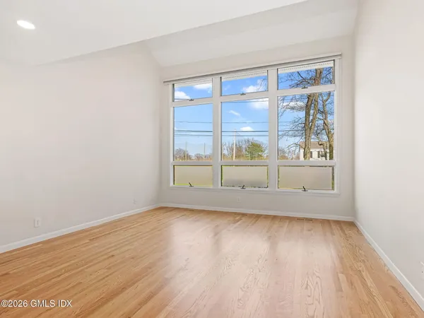 a kitchen with a sink a stove a refrigerator and a window