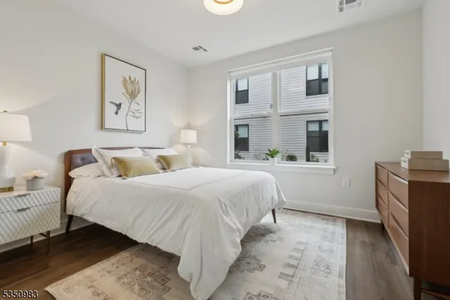 a bedroom with bed and a window