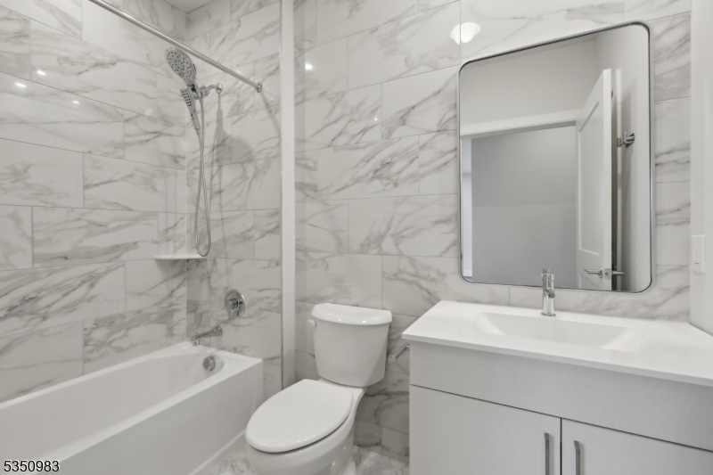 434 Springfield Avenue, Unit 119 Berkeley Heights, NJ 07922 - Photo 12 of 29 a bathroom with a sink toilet and shower