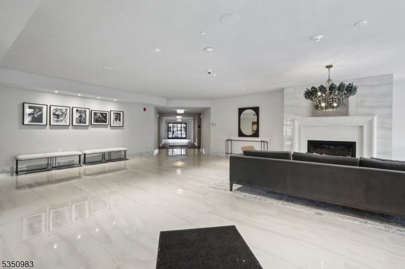 434 Springfield Avenue, Unit 119 Berkeley Heights, NJ 07922 - Photo 14 of 29 a living room with furniture and a fireplace