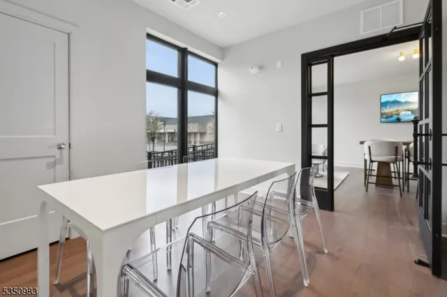 a view of livingroom and kitchen with furniture and floor to ceiling window