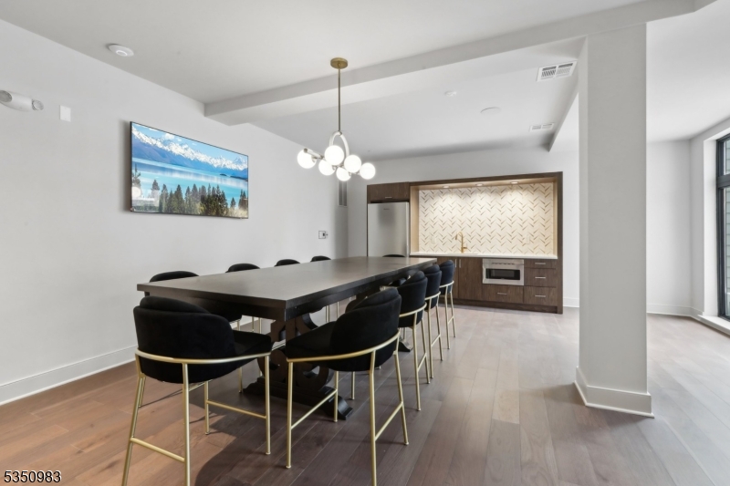 434 Springfield Avenue, Unit 119 Berkeley Heights, NJ 07922 - Photo 21 of 29 a view of a dining room with furniture window and wooden floor