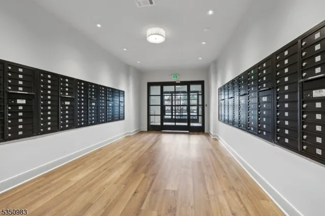a view of wooden floor and windows in a room