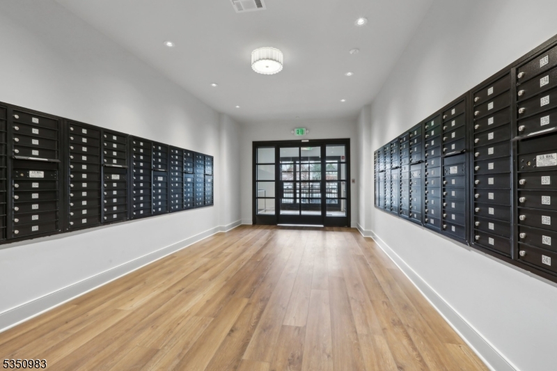 434 Springfield Avenue, Unit 119 Berkeley Heights, NJ 07922 - Photo 24 of 29 a view of wooden floor and windows in a room