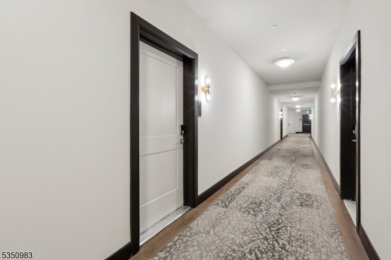 434 Springfield Avenue, Unit 119 Berkeley Heights, NJ 07922 - Photo 3 of 29 a view of a hallway to other door