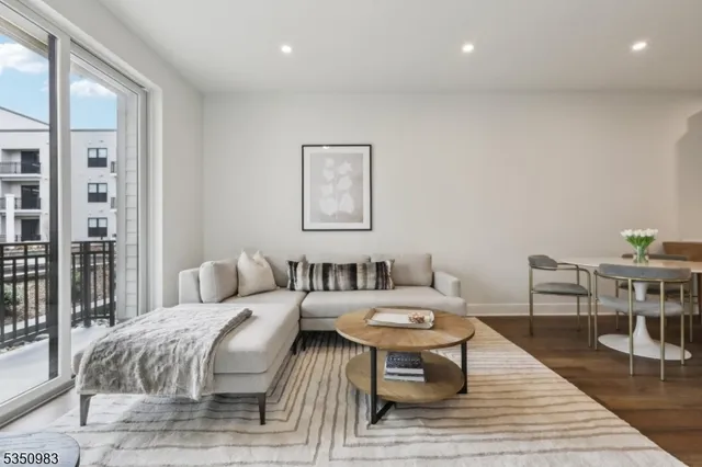 a hotel room with two beds and a table