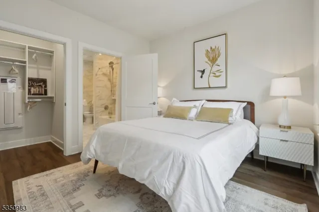 a bedroom with a bed and a couch