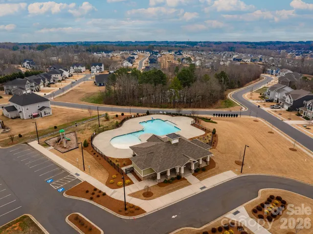 a view of swimming pool with a yard