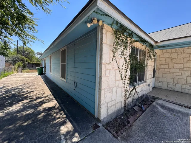 a balcony with view of outdoor space