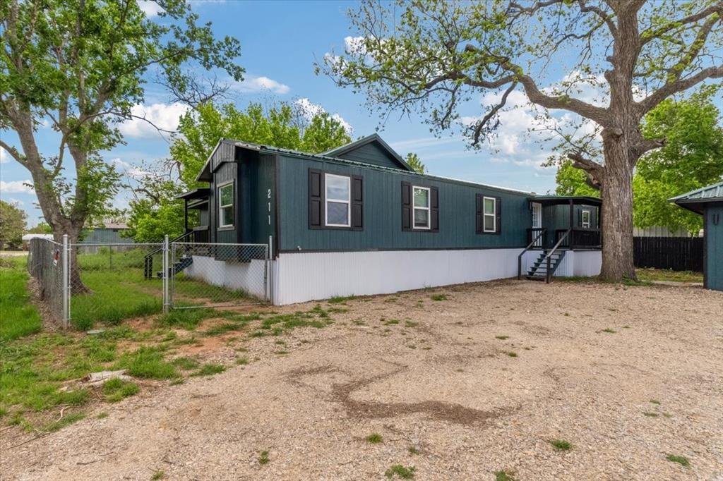 211 Kickapoo Trail Weatherford, TX 76087 - Photo 13 of 34 Side entry for 3-bedroom side