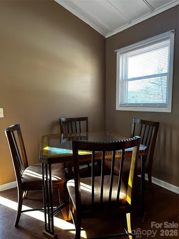 a view of a dining room with furniture and window