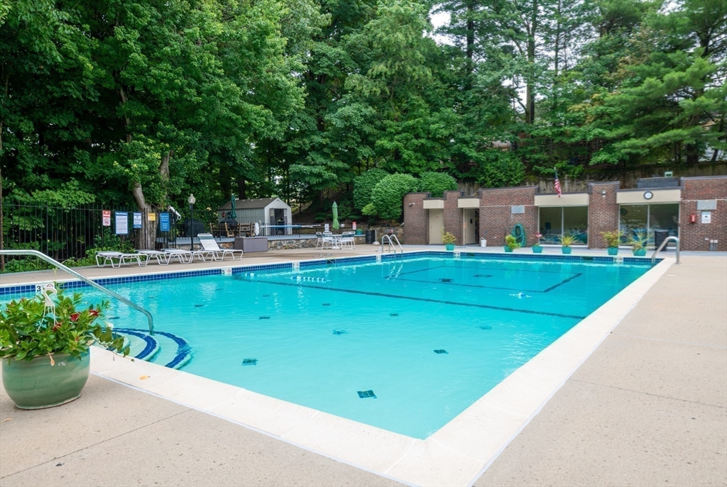 68 Main Street, Unit 36C Stoneham, MA 02180 - Photo 19 of 19 a view of a swimming pool with a patio
