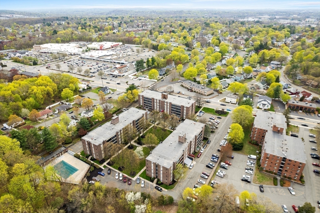 68 Main Street, Unit 36C Stoneham, MA 02180 - Photo 3 of 19 an aerial view of residential houses with outdoor space